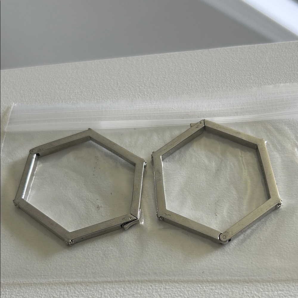 Tory Burch Silver Hexagon Bracelets.